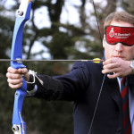 Britain's Prince William takes part in an archery lesson in Llandudno